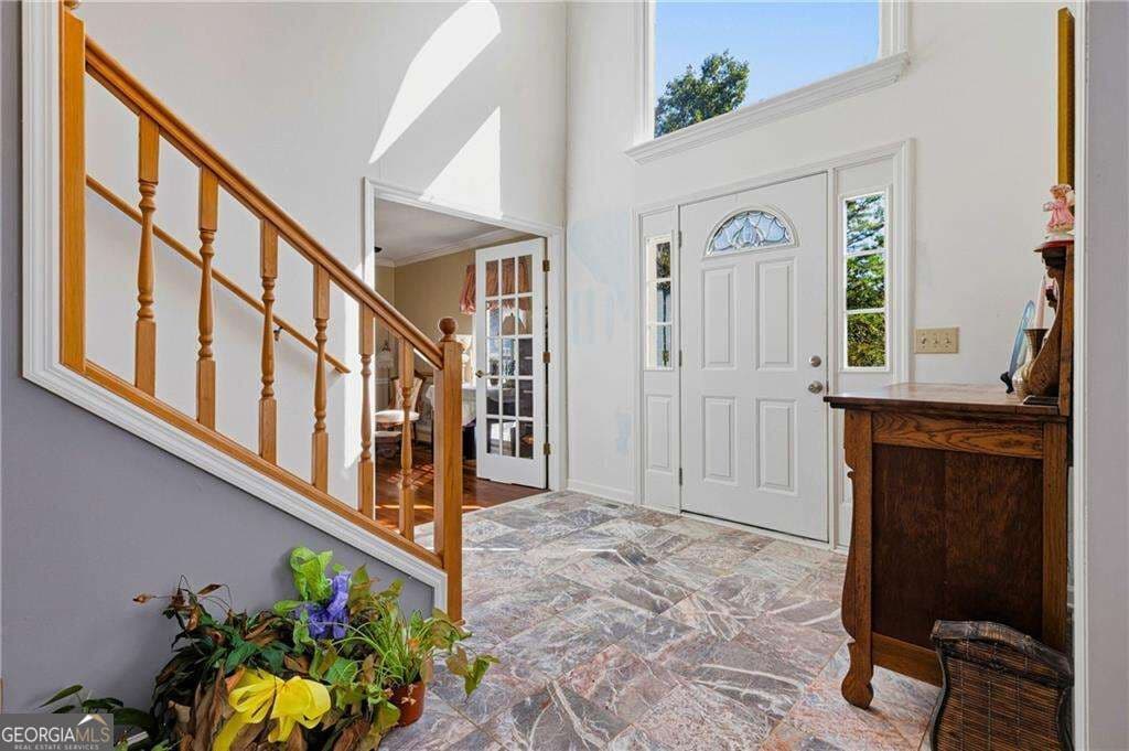 5 bedroom, 4 bathroom, 4,890 sq ft single family residence for sale at 609 Apache Trail, Woodstock, GA 30189 — photo 2