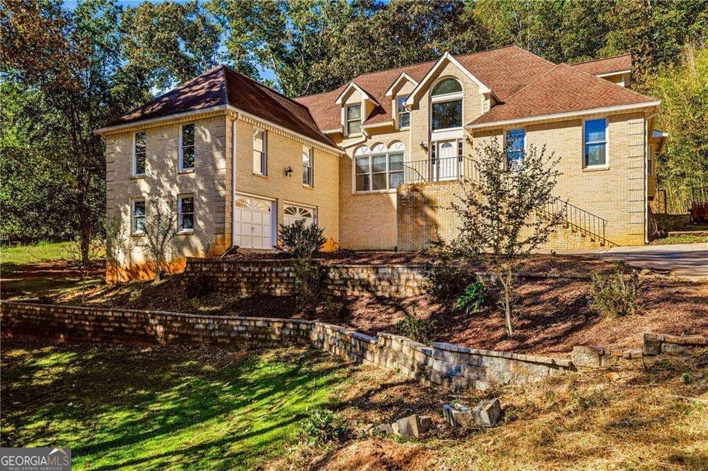 5 bedroom, 4 bathroom, 4,890 sq ft single family residence for sale at 609 Apache Trail, Woodstock, GA 30189