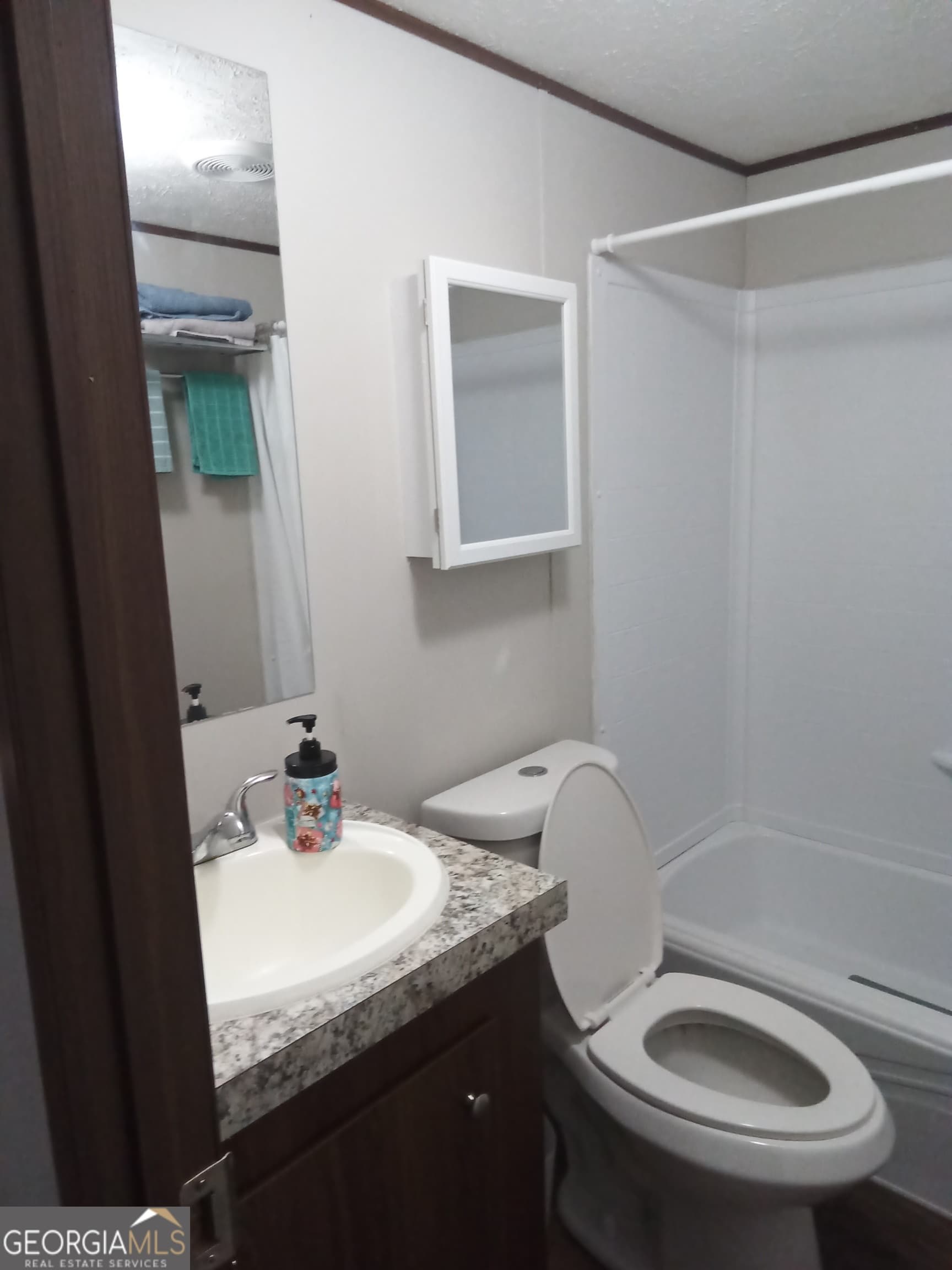 3 bedroom, 2 bathroom, 1,064 sq ft manufactured home,single family residence for sale at 445 Saint Charles Drive, East Dublin, GA 31027 — photo 3