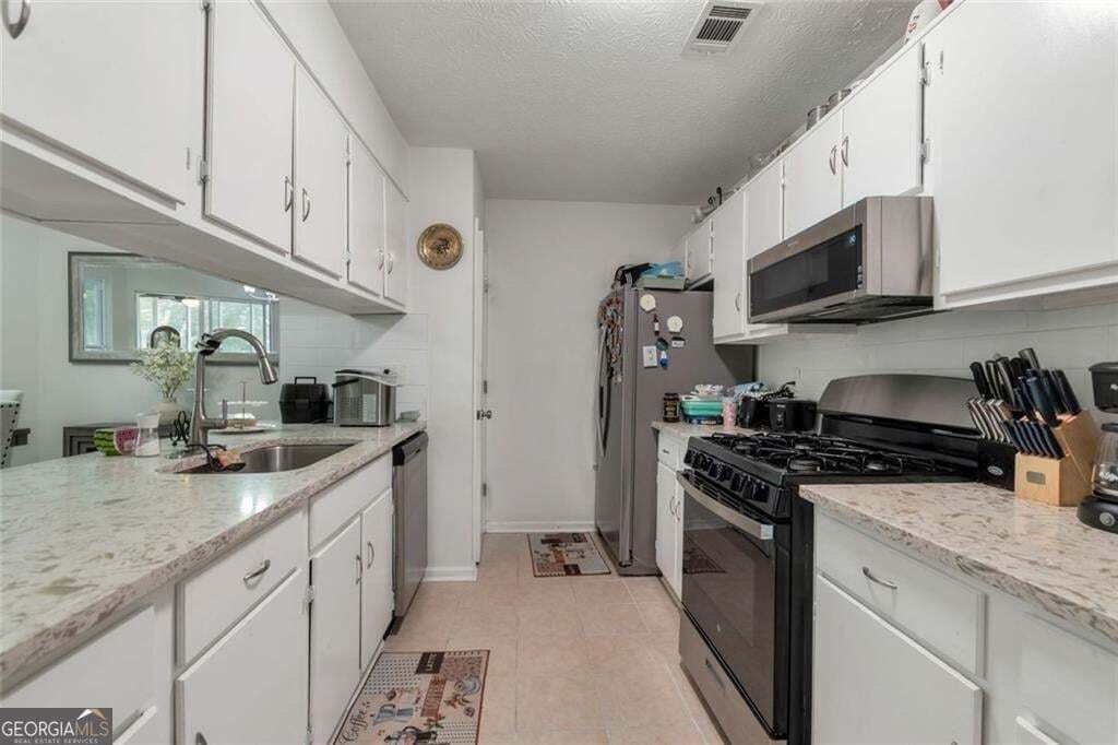 4 bedroom, 2 bathroom, 1,440 sq ft single family residence for sale at 2000 Wendover Drive, Snellville, GA 30078 — photo 6