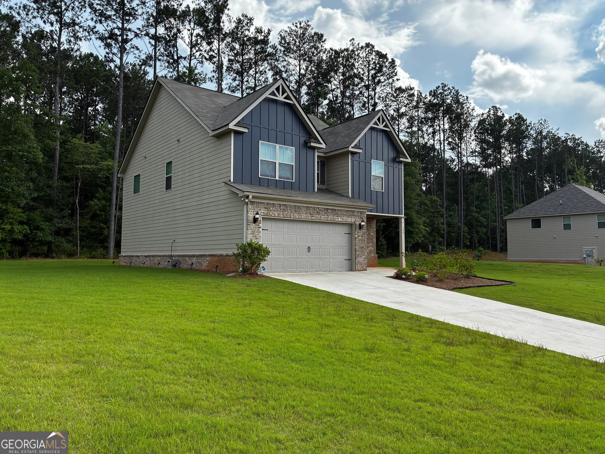 4 bedroom, 2.5 bathroom, 2,409 sq ft single family residence for sale at 109 Armory Creek Drive, Jackson, GA 30233 — photo 2