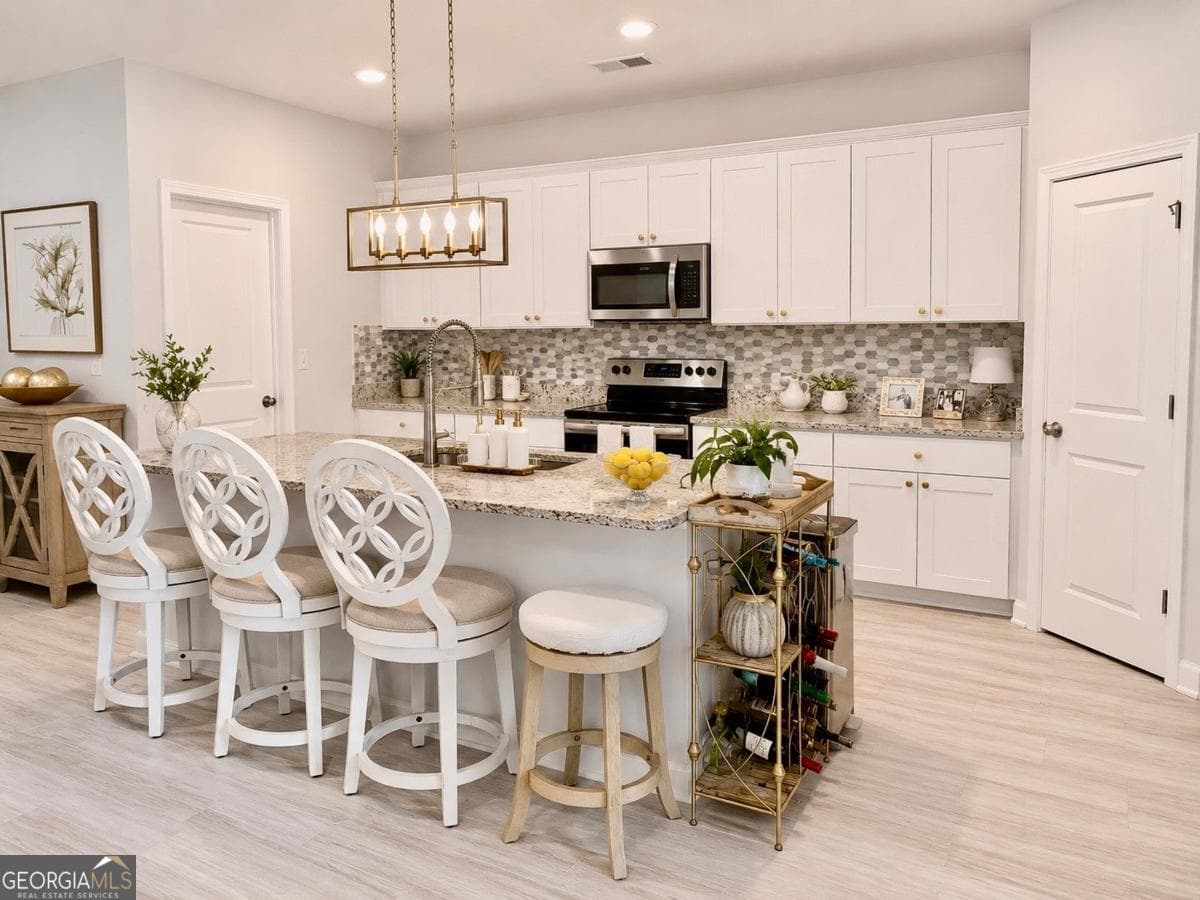 5 bedroom, 2.5 bathroom single family residence for sale at 79 Blue River Court, Pendergrass, GA 30567 — photo 6