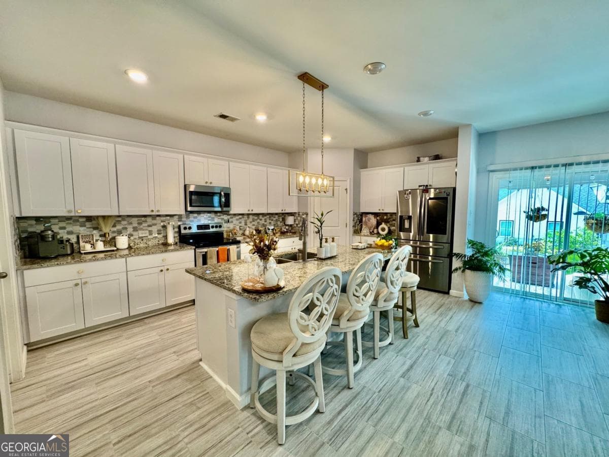 5 bedroom, 2.5 bathroom single family residence for sale at 79 Blue River Court, Pendergrass, GA 30567 — photo 7