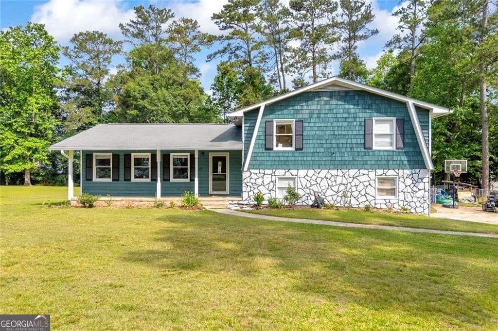 3 bedroom, 2 bathroom, 2,416 sq ft single family residence for sale at 144 Zion Wood Road, Loganville, GA 30052 — photo 1 of 54