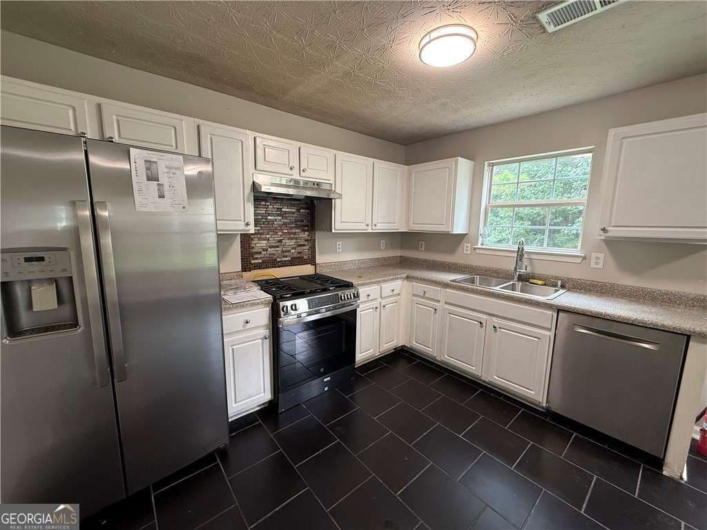 4 bedroom, 3 bathroom single family residence for sale at 1023 Quail Hunt Drive, Riverdale, GA 30296 — photo 4
