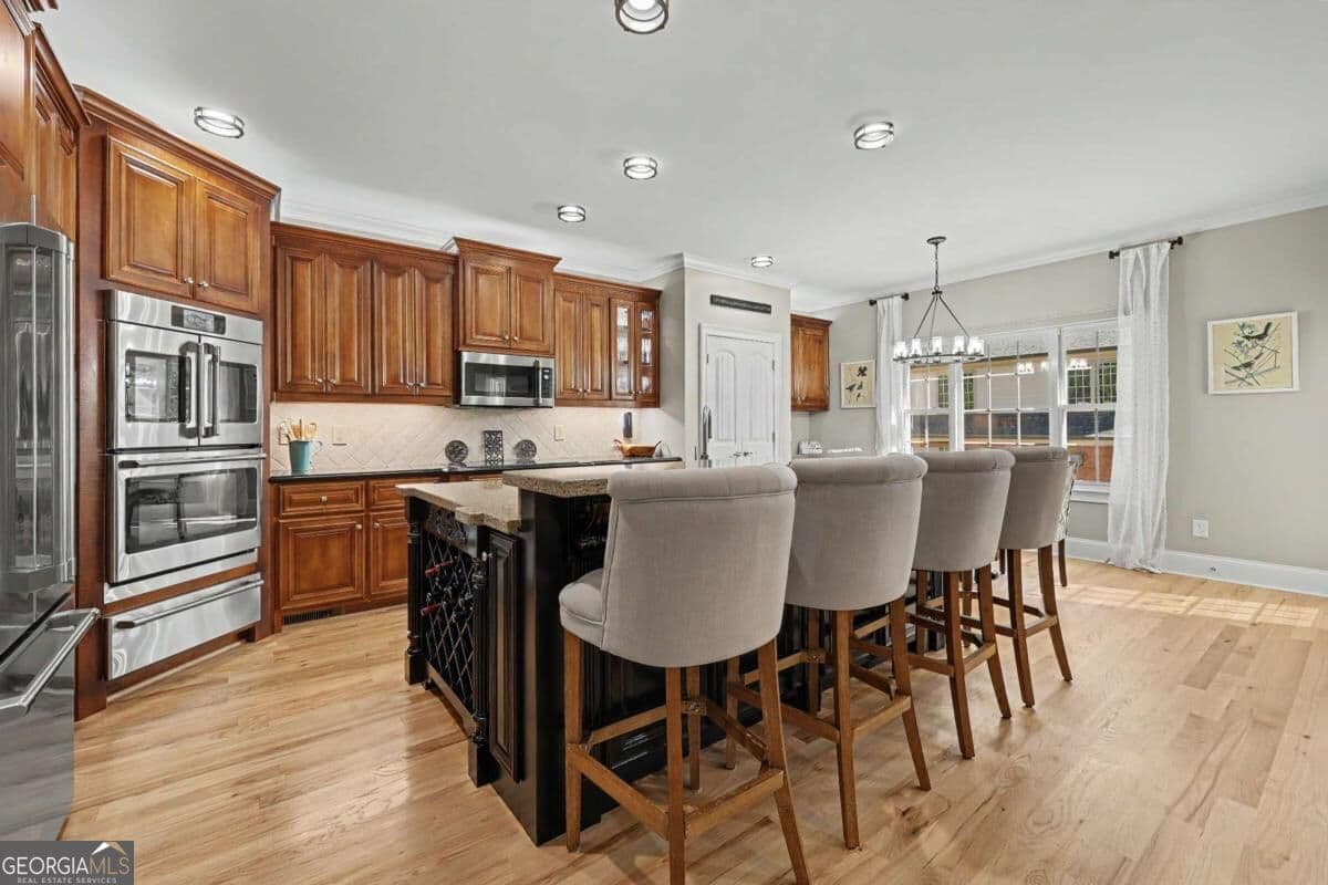 9 bedroom, 6 bathroom, 7,506 sq ft single family residence for sale at 116 River Bend Drive, Hoschton, GA 30548 — photo 7