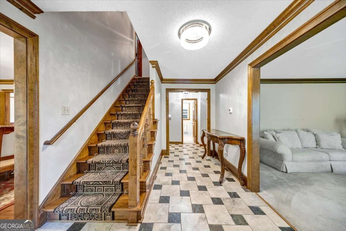 5 bedroom, 4.5 bathroom, 4,293 sq ft single family residence for sale at 3024 Ravenwolfe Way, Snellville, GA 30039 — photo 2