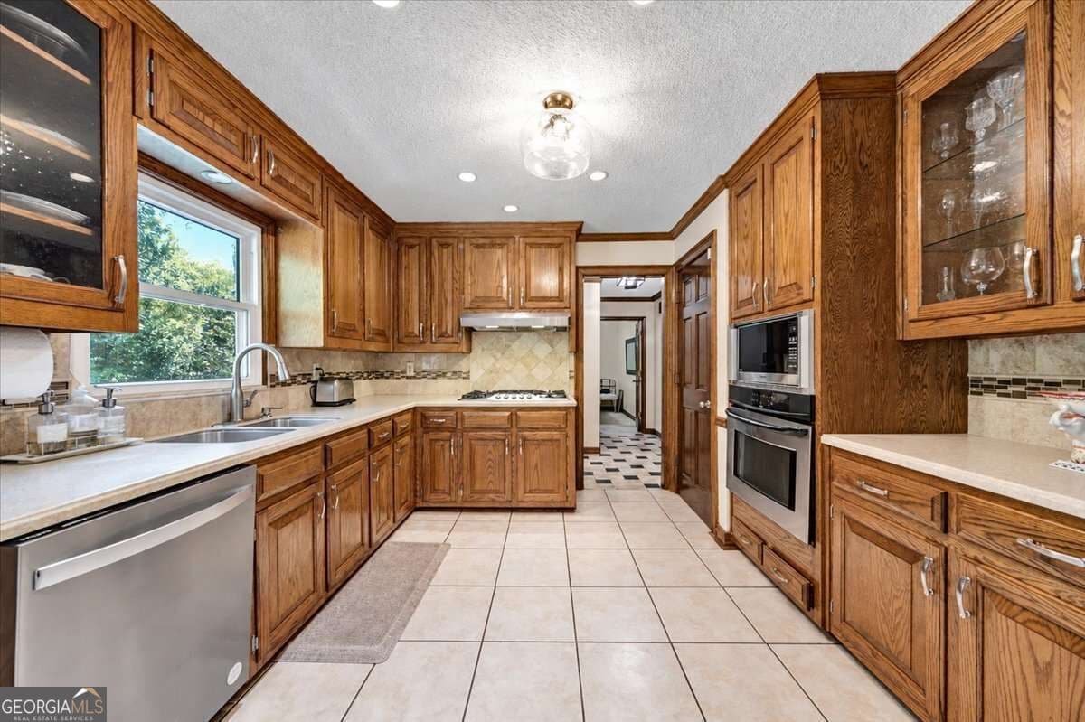 5 bedroom, 4.5 bathroom, 4,293 sq ft single family residence for sale at 3024 Ravenwolfe Way, Snellville, GA 30039 — photo 9