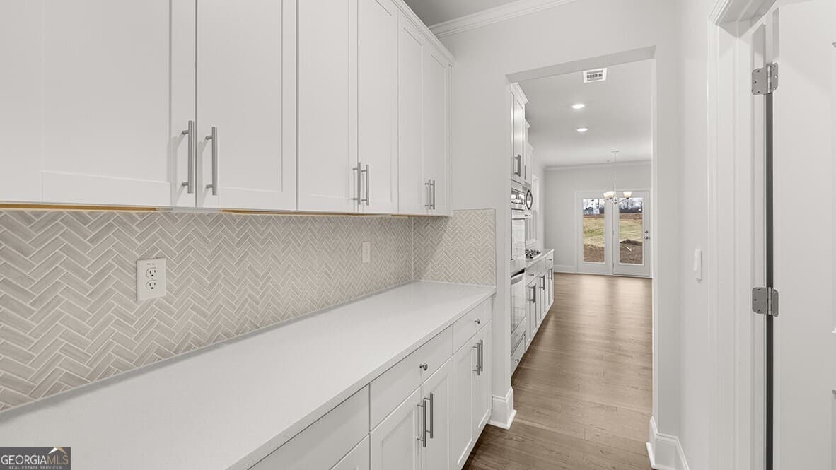 4 bedroom, 3 bathroom, 3,106 sq ft single family residence for sale at 7197 Bocholt Drive, South Fulton, GA 30349 — photo 8