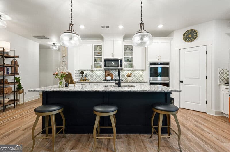 3 bedroom, 2.5 bathroom, 2,335 sq ft single family residence for sale at 409 Mcdaniel Place, Canton, GA 30115 — photo 6