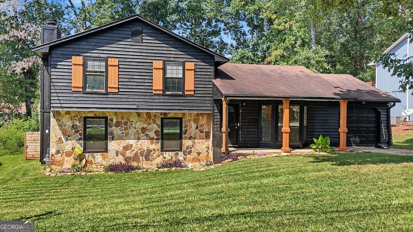 4 bedroom, 3 bathroom, 1,853 sq ft single family residence for sale at 1961 Woodlot Trail, Lithonia, GA 30058