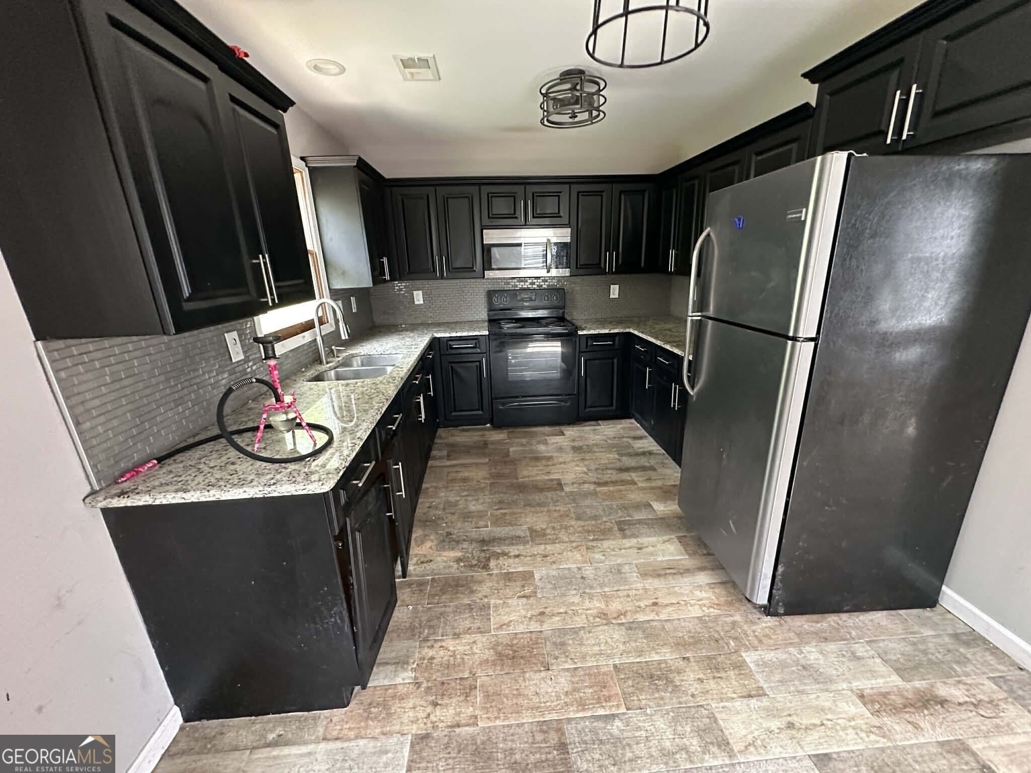 5 bedroom, 4 bathroom, 4,620 sq ft single family residence for sale at 4065 Pate Branch Court, Loganville, GA 30052 — photo 7