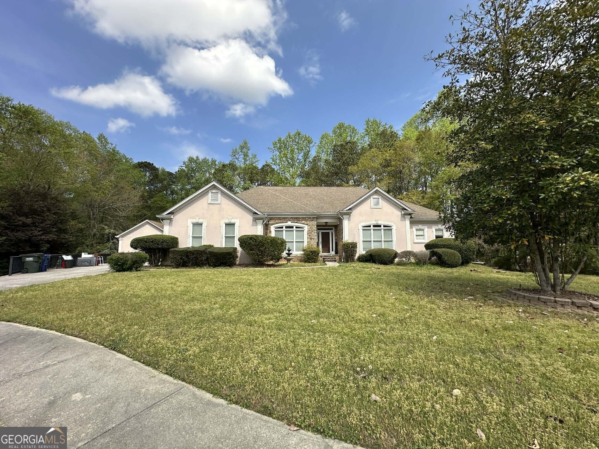 5 bedroom, 4 bathroom, 4,620 sq ft single family residence for sale at 4065 Pate Branch Court, Loganville, GA 30052 — photo 1 of 44