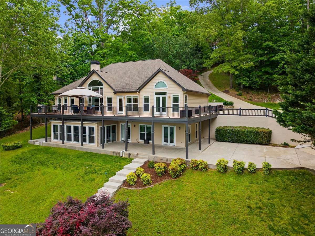 4 bedroom, 3.5 bathroom, 4,497 sq ft single family residence for sale at 3386 Small Woods Lane, Gainesville, GA 30506 — photo 2