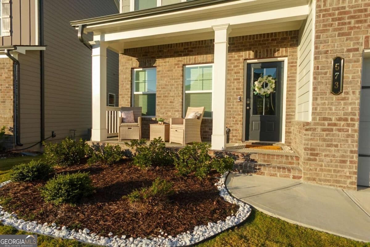 5 bedroom, 3 bathroom, 2,290 sq ft single family residence for sale at 573 Auburn Crossing Drive, Auburn, GA 30011 — photo 3