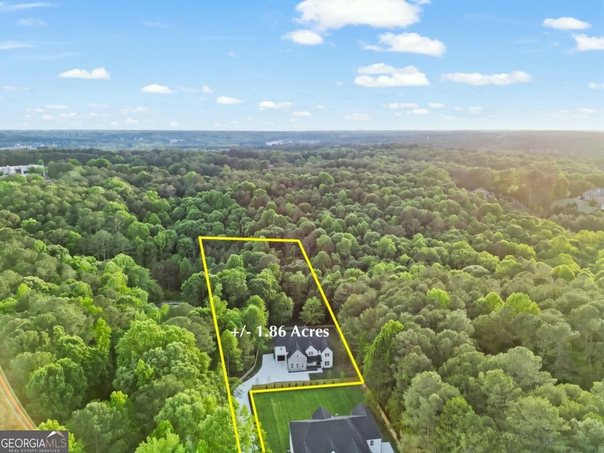 4 bedroom, 4.5 bathroom, 5,200 sq ft single family residence for sale at 3461 Callie Still Road, Lawrenceville, GA 30045 — photo 4