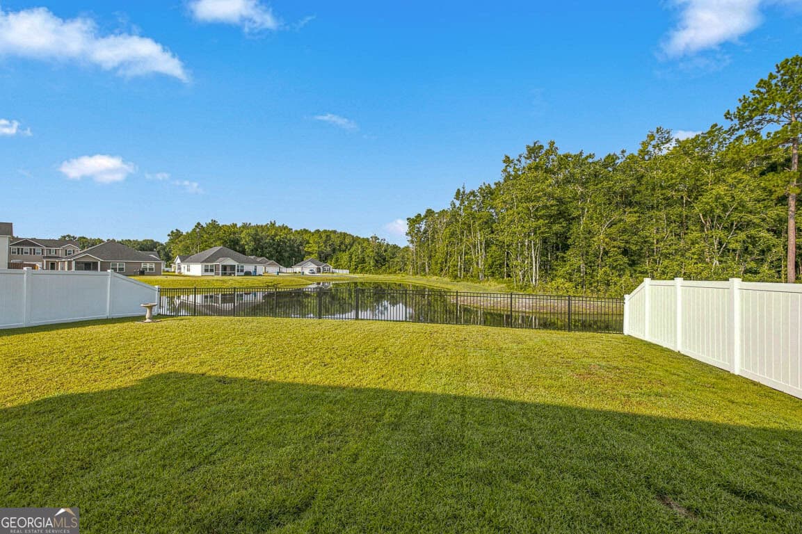5 bedroom, 3 bathroom, 2,460 sq ft single family residence for sale at 11020 Woodland Trail, Brunswick, GA 31525 — photo 2