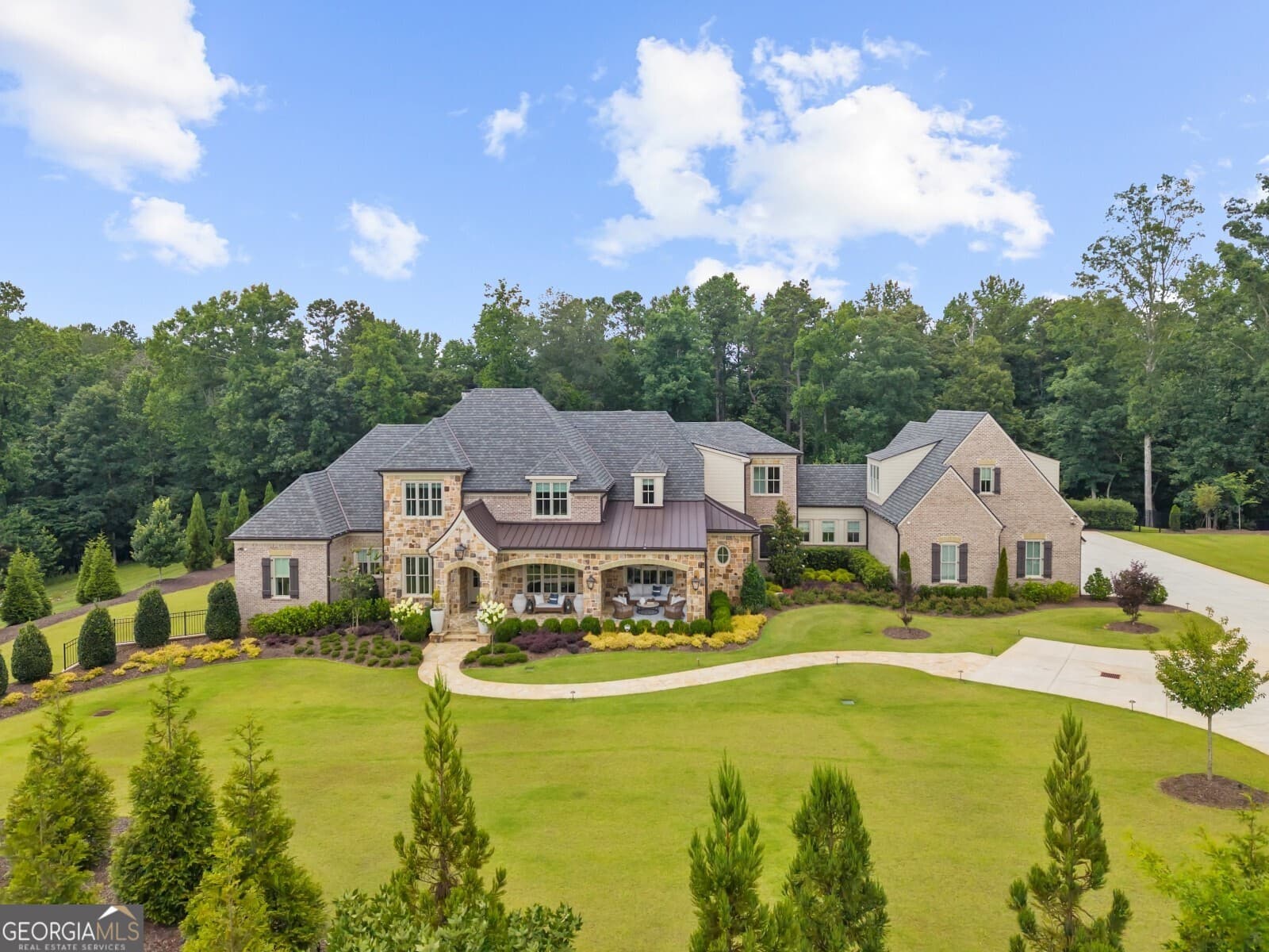 7 bedroom, 8.5 bathroom, 13,050 sq ft single family residence for sale at 570 Lost River Bend, Milton, GA 30004 — photo 1 of 98