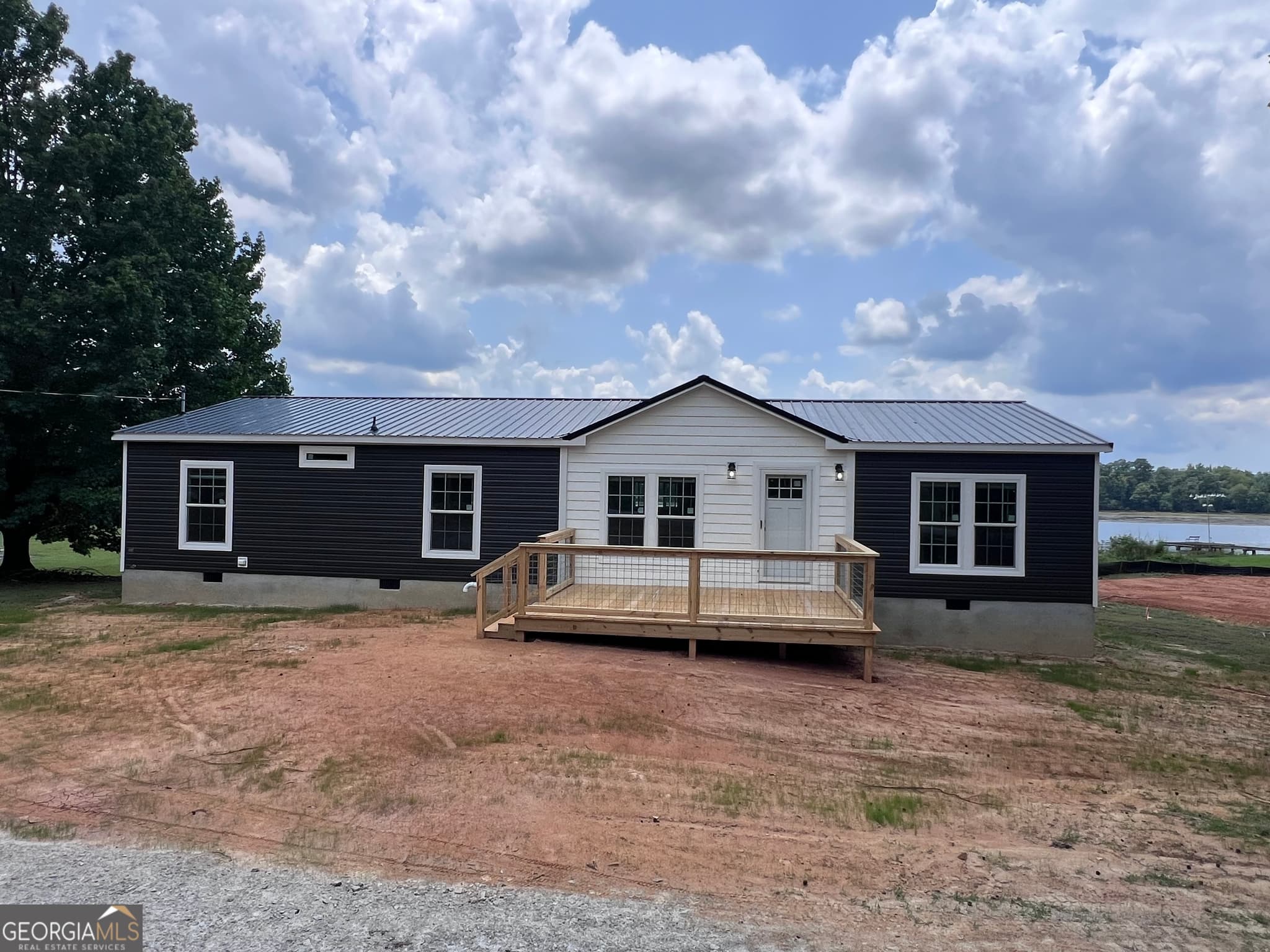4 bedroom, 2 bathroom, 1,560 sq ft manufactured home,single family residence for sale at 105 N Lakeshore Drive, Ivey, GA 31031 — photo 1 of 17