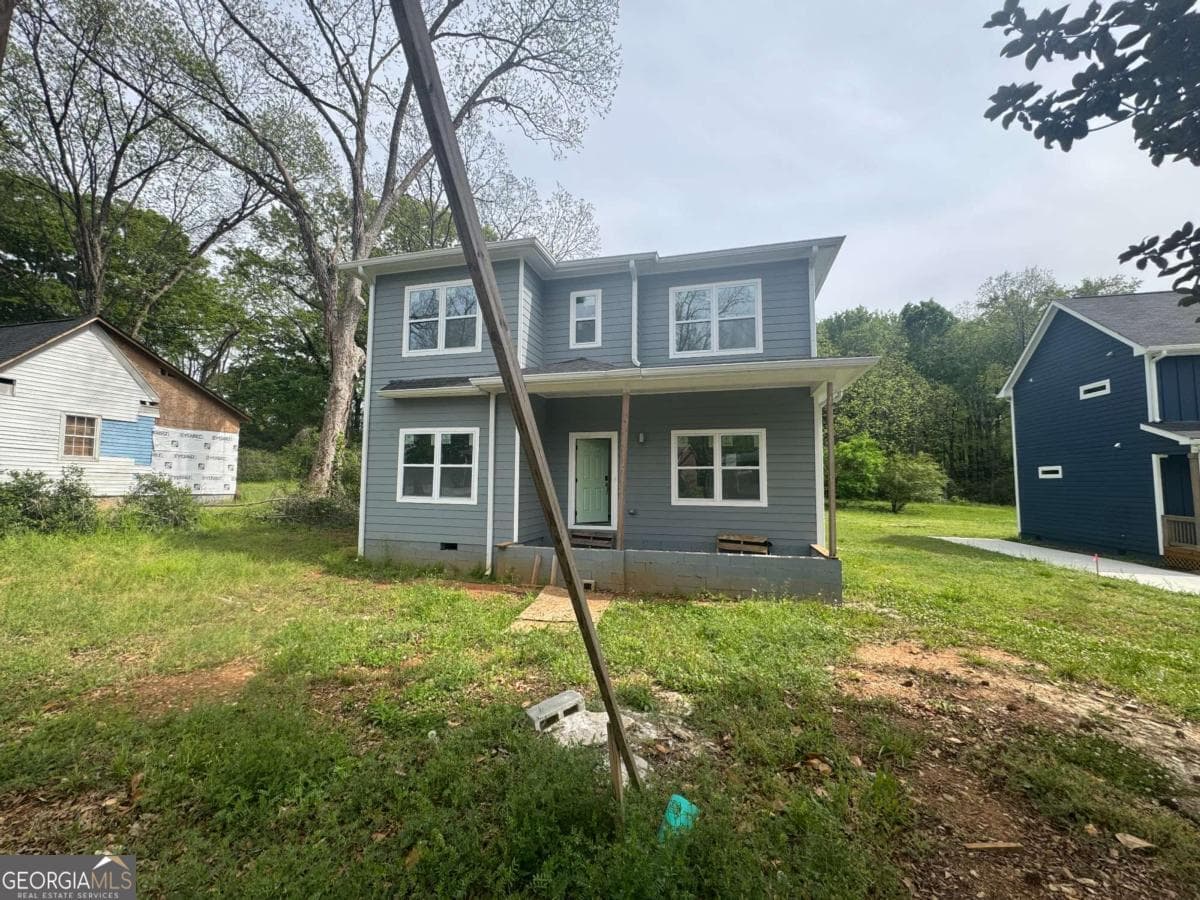 4 bedroom, 3 bathroom single family residence for sale at 6895 Magnolia Street, Lithonia, GA 30058 — photo 1 of 13
