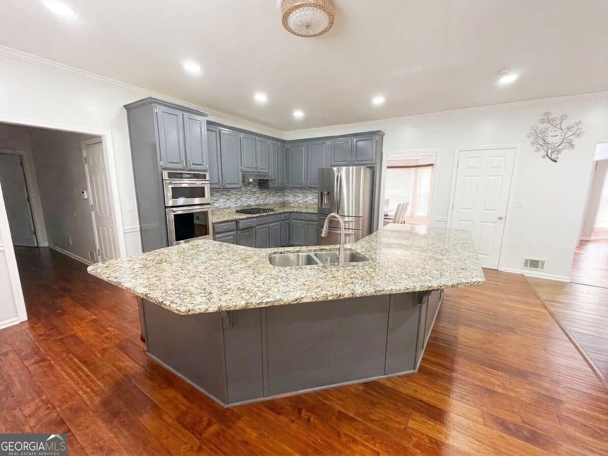5 bedroom, 4 bathroom, 4,400 sq ft single family residence for sale at 2365 Friars Gate Drive, Lawrenceville, GA 30043 — photo 5