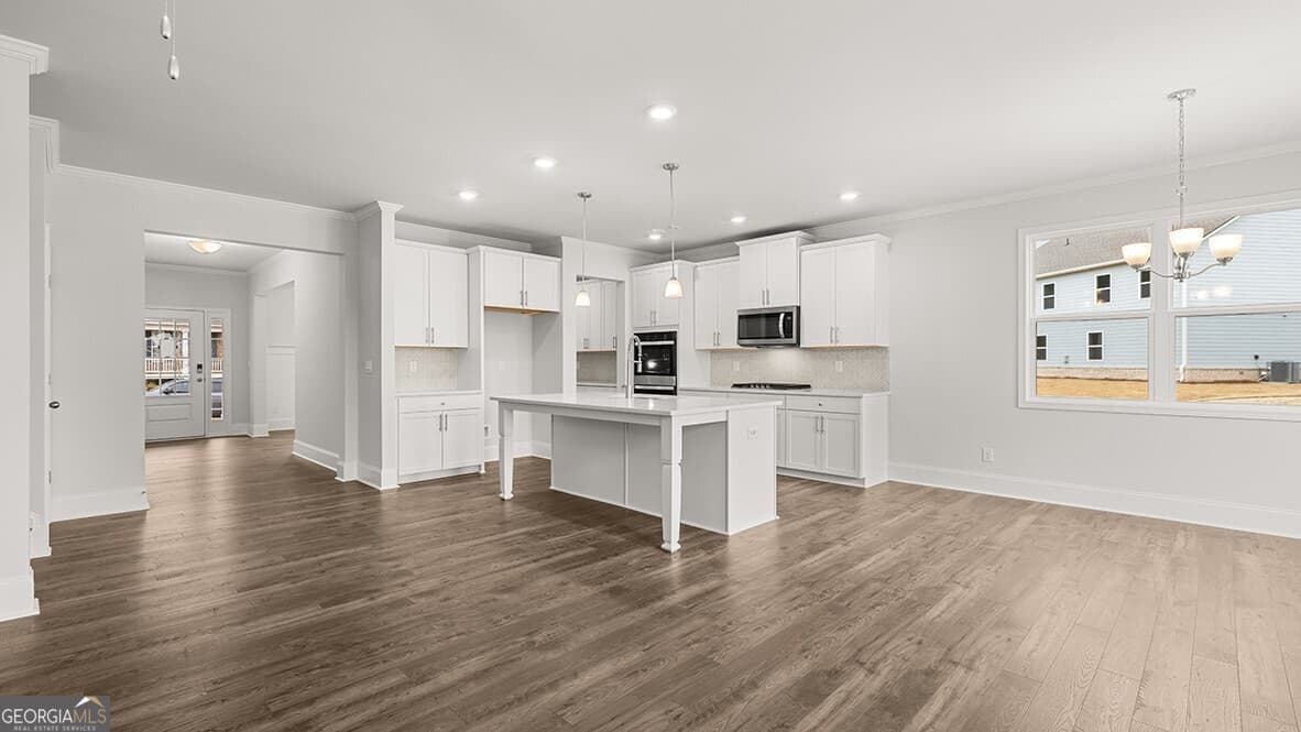4 bedroom, 3 bathroom, 3,106 sq ft single family residence for sale at 7165 Bocholt Drive, South Fulton, GA 30349 — photo 6