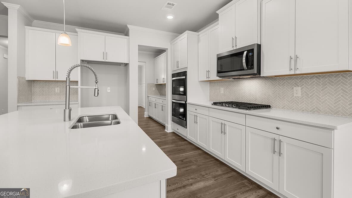 4 bedroom, 3 bathroom, 3,106 sq ft single family residence for sale at 7165 Bocholt Drive, South Fulton, GA 30349 — photo 7