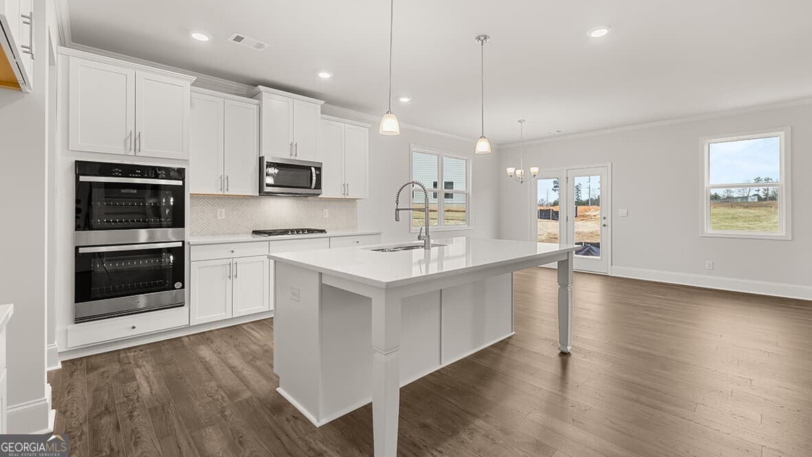 4 bedroom, 3 bathroom, 3,106 sq ft single family residence for sale at 7165 Bocholt Drive, South Fulton, GA 30349 — photo 4