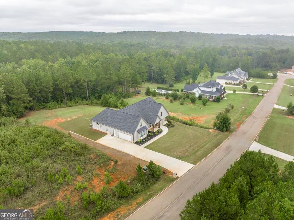 4 bedroom, 3 bathroom, 3,561 sq ft single family residence for sale at 216 Creekside Trail, Forsyth, GA 31029 — photo 2