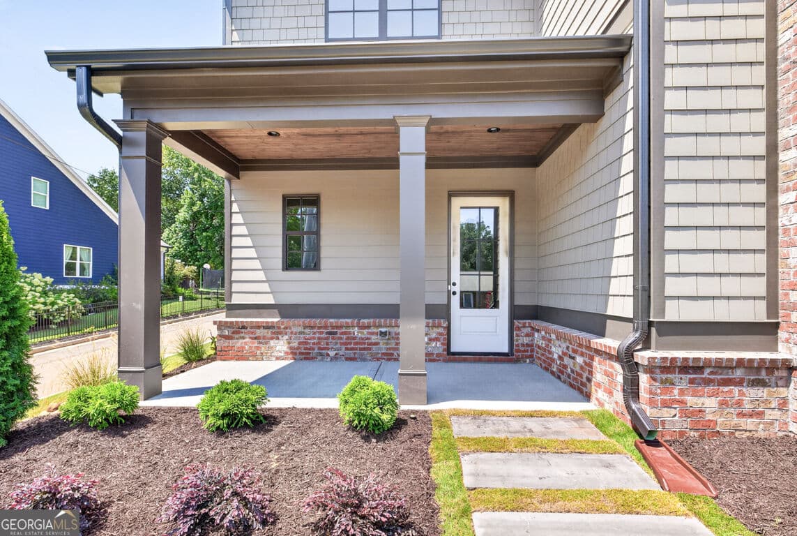 4 bedroom, 3.5 bathroom, 3,112 sq ft single family residence for sale at 5816 Mitchell Street, Flowery Branch, GA 30542 — photo 2