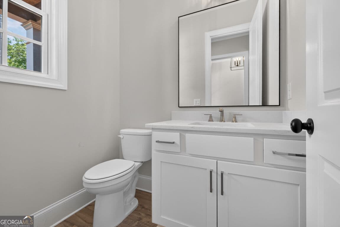 4 bedroom, 3.5 bathroom, 3,112 sq ft single family residence for sale at 5816 Mitchell Street, Flowery Branch, GA 30542 — photo 5