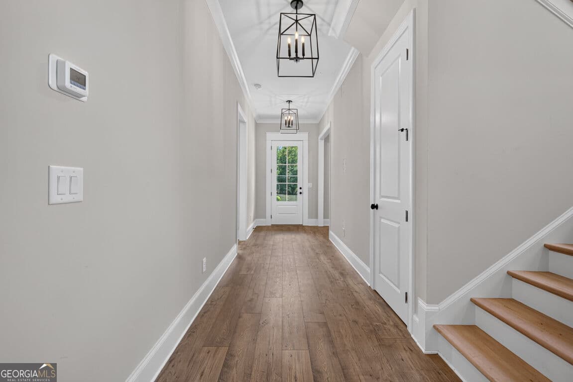 4 bedroom, 3.5 bathroom, 3,112 sq ft single family residence for sale at 5816 Mitchell Street, Flowery Branch, GA 30542 — photo 4