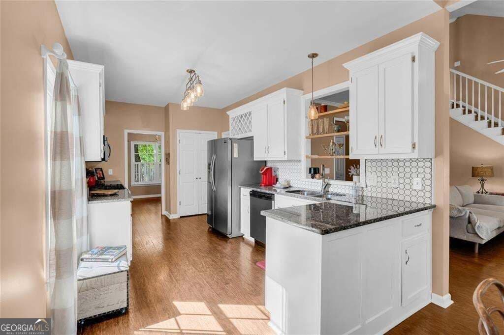 5 bedroom, 3.5 bathroom, 3,756 sq ft single family residence for sale at 214 Kingsley Way, Woodstock, GA 30188 — photo 6