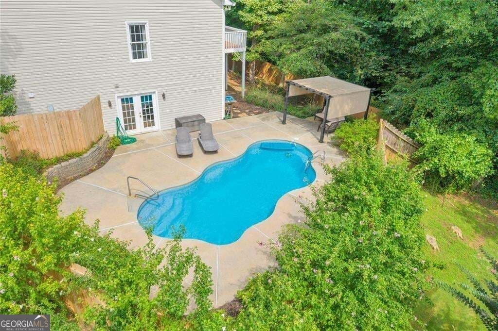 5 bedroom, 3.5 bathroom, 3,756 sq ft single family residence for sale at 214 Kingsley Way, Woodstock, GA 30188 — photo 3