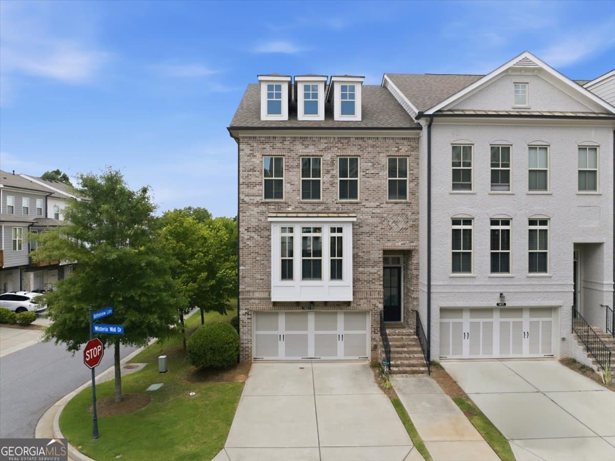 4 bedroom, 3.5 bathroom townhouse for sale at 1421 Wisteria Wall Drive, Suwanee, GA 30024 — photo 1 of 52