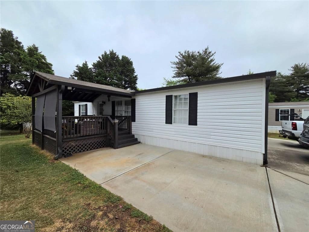 3 bedroom, 2 bathroom, 1,152 sq ft manufactured home,single family residence for sale at 4855 Peachtree Drive, Buford, GA 30518 — photo 2