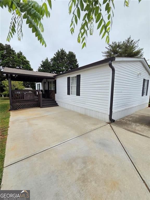 3 bedroom, 2 bathroom, 1,152 sq ft manufactured home,single family residence for sale at 4855 Peachtree Drive, Buford, GA 30518 — photo 1 of 24