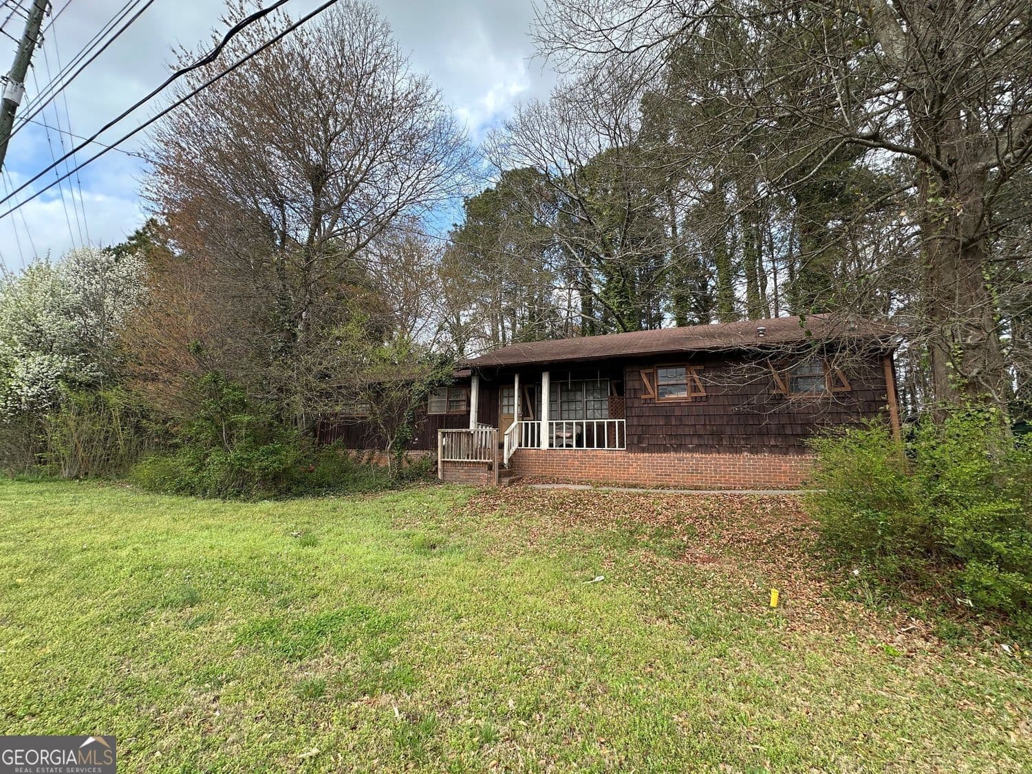 3 bedroom, 2 bathroom, 1,338 sq ft single family residence for sale at 7243 Highway 92 Road, Woodstock, GA 30189