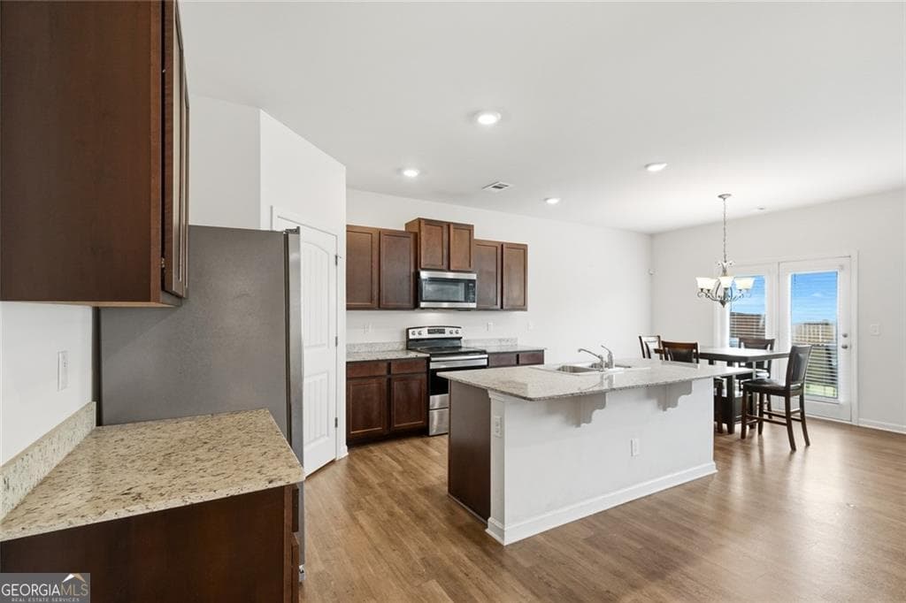 5 bedroom, 3.5 bathroom, 2,648 sq ft single family residence for sale at 5396 Pennington Court, Atlanta, GA 30349 — photo 5