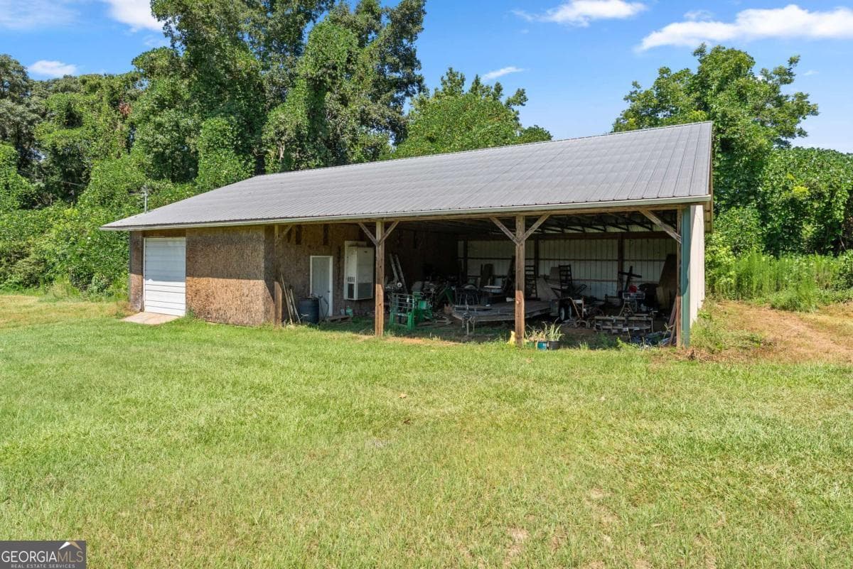 4 bedroom, 3 bathroom, 6,428 sq ft single family residence for sale at 1121 Beacon Light Road, Hartwell, GA 30643 — photo 6