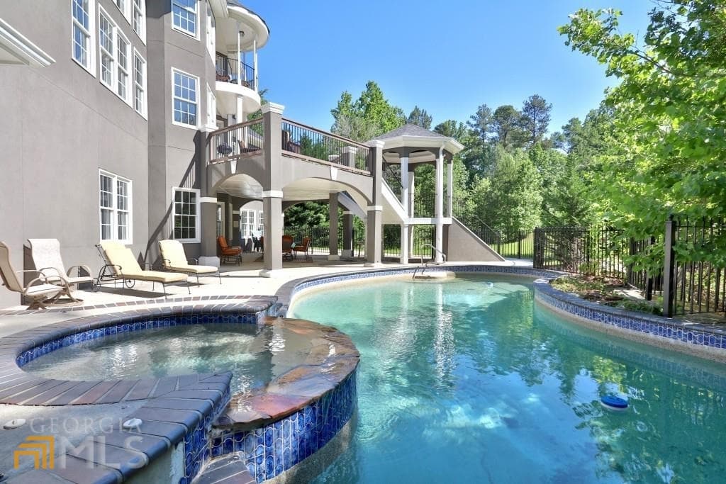 6 bedroom, 5.5 bathroom, 5,959 sq ft single family residence for sale at 910 Woodward Park Drive, Suwanee, GA 30024 — photo 3