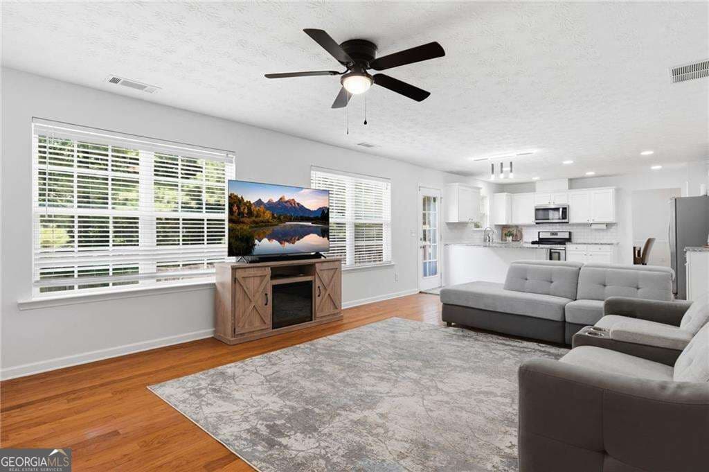 5 bedroom, 3.5 bathroom, 3,658 sq ft single family residence for sale at 5492 Skylar Creek Lane, Buford, GA 30518 — photo 8