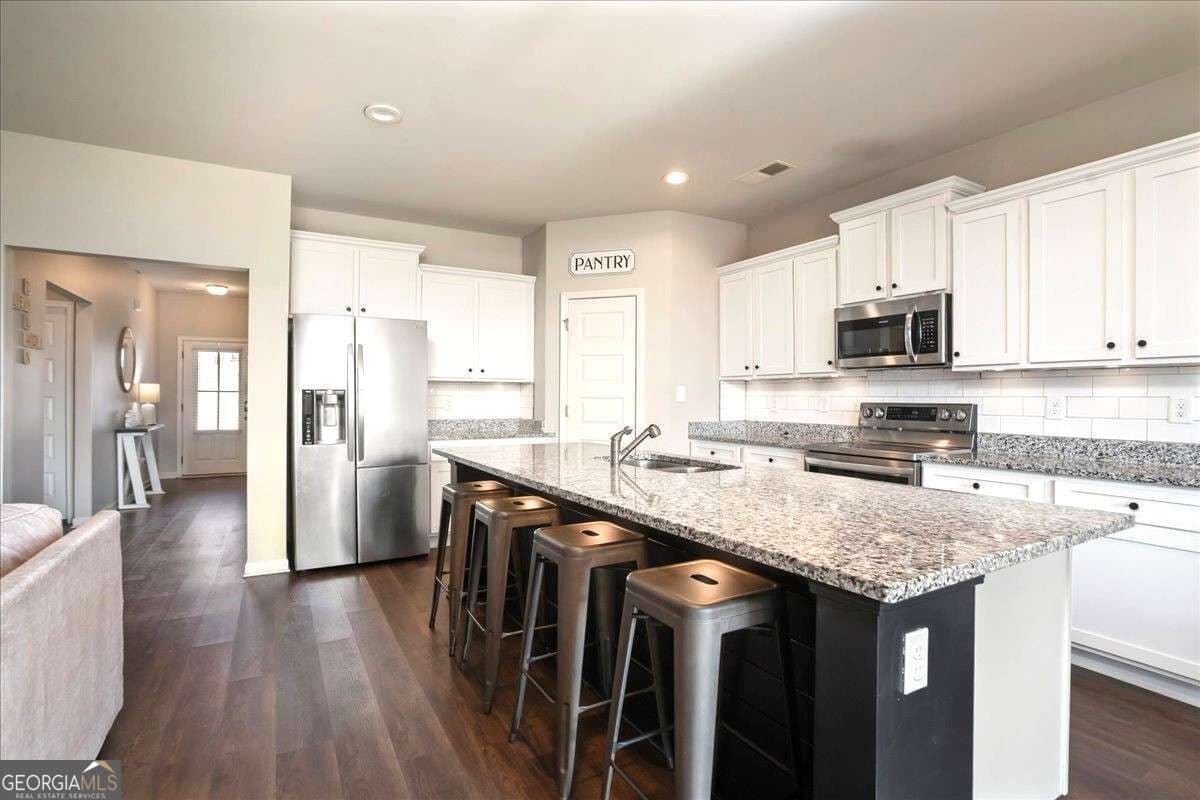 4 bedroom, 3 bathroom, 2,215 sq ft single family residence for sale at 1978 Waterside Circle, Bethlehem, GA 30620 — photo 3