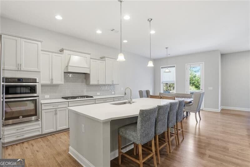 7 bedroom, 5.5 bathroom, 6,192 sq ft single family residence for sale at 3813 Whithorn Way, Kennesaw, GA 30152 — photo 5