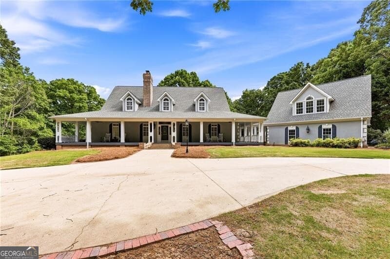4 bedroom, 4.5 bathroom, 7,821 sq ft single family residence for sale at 4264 Joe Chandler Road, Gillsville, GA 30543 — photo 4