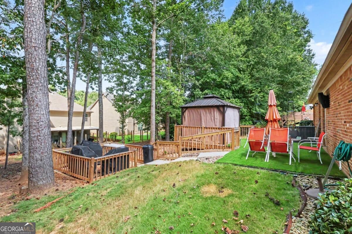 4 bedroom, 3 bathroom, 2,174 sq ft single family residence for sale at 8001 Gossamer Drive, Fairburn, GA 30213 — photo 4