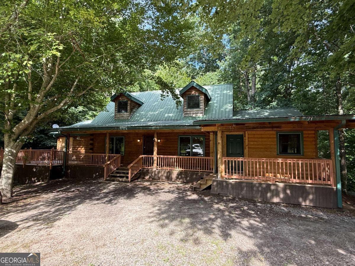 4 bedroom, 3 bathroom, 3,200 sq ft cabin,single family residence for rent at 2405 Mountain Road, Alpharetta, GA 30004 for $2,500 a month — photo 1 of 14