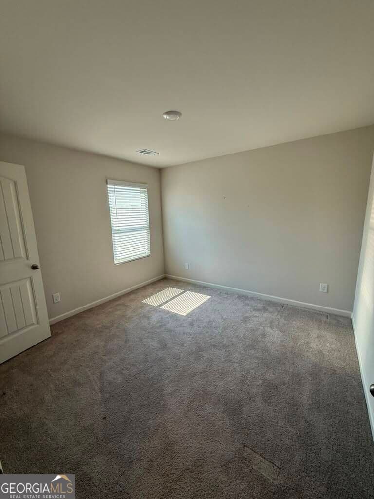 5 bedroom, 4 bathroom, 3,480 sq ft single family residence for sale at 7481 Hawk Tail Way, Fairburn, GA 30213 — photo 6