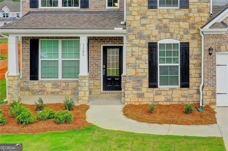 5 bedroom, 4 bathroom, 3,555 sq ft single family residence for sale at 5280 Blue Mountain Lane, Cumming, GA 30040 — photo 3