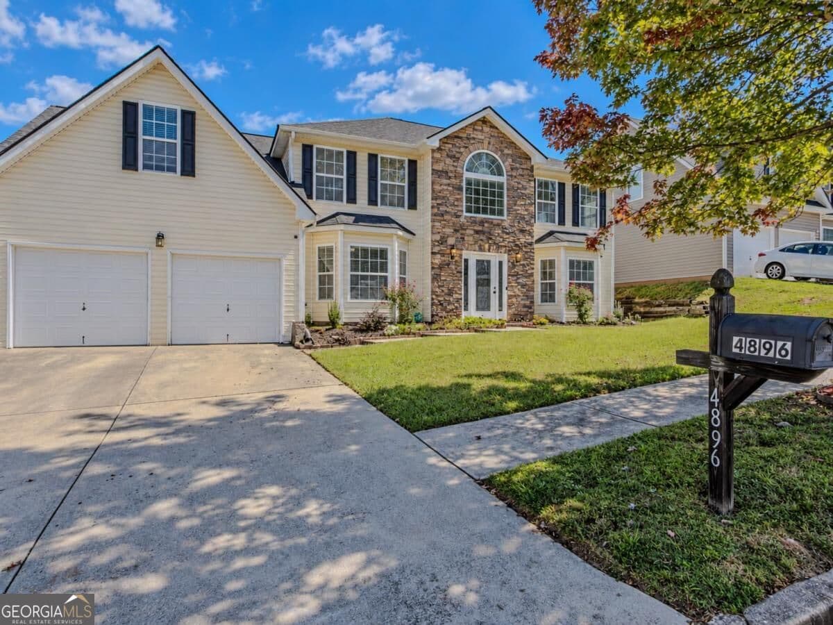 5 bedroom, 3 bathroom, 2,974 sq ft single family residence for sale at 4896 Laythan Jace Court, Snellville, GA 30039 — photo 1 of 49